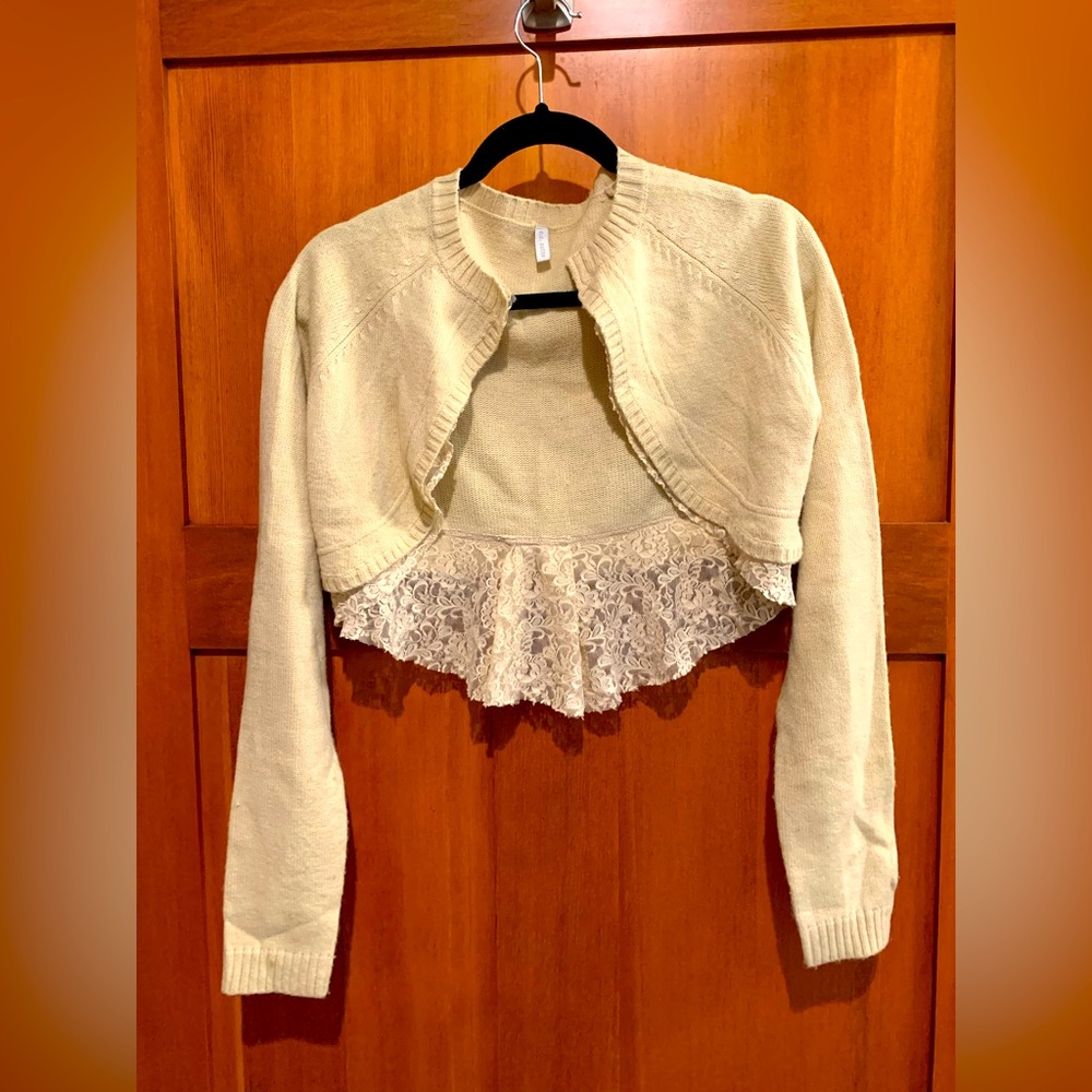 Cream Cropped Sweater with lace detail on the Back.